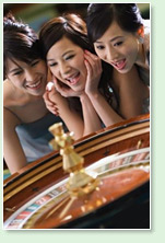 oriental girls playing roulette in a real casino